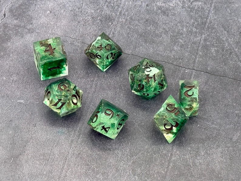 Druidic Tendrils translucent green resin dice with dark branching patterns and gold numbers